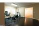 Workout room features hardwood flooring and exercise equipment by the window at 8245 Mill Run Trl, Whitesburg, GA 30185