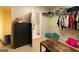 Spacious walk-in closet with dark wood drawers and plenty of hanging storage at 8245 Mill Run Trl, Whitesburg, GA 30185
