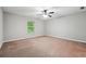 Spacious bedroom with neutral carpet, a ceiling fan, and large window at 2366 Proctor Creek Enclave, Acworth, GA 30101