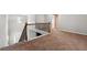 Hallway landing with carpet floors and wood and iron banister at 2366 Proctor Creek Enclave, Acworth, GA 30101