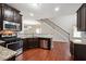Well-equipped kitchen boasts stainless steel appliances, granite countertops, and abundant cabinet space at 2366 Proctor Creek Enclave, Acworth, GA 30101