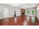 Spacious living room with hardwood floors, a fireplace, and ample natural light at 2366 Proctor Creek Enclave, Acworth, GA 30101