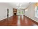 Expansive living room featuring hardwood floors, natural light, and fireplace feature at 2366 Proctor Creek Enclave, Acworth, GA 30101