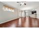 Open living room with hardwood floors and natural light, perfect for entertaining or relaxation at 2366 Proctor Creek Enclave, Acworth, GA 30101