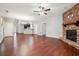 Inviting living area showcasing a stone fireplace, hardwood floors, and seamless flow to other spaces at 2366 Proctor Creek Enclave, Acworth, GA 30101