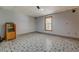 Open basement area featuring decorative tile flooring, recessed lighting, and access to a window at 2436 Green Hollow Ct, Conyers, GA 30012