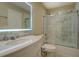 Bathroom featuring a marble countertop, glass shower, and toilet in a neutral color scheme at 2436 Green Hollow Ct, Conyers, GA 30012