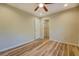 Bedroom featuring wood floors, neutral walls, and an attached closet at 2436 Green Hollow Ct, Conyers, GA 30012