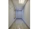 Narrow walk-in closet with built-in shelving and window at 2436 Green Hollow Ct, Conyers, GA 30012