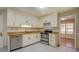 Bright kitchen with white cabinetry and stainless steel appliances at 2436 Green Hollow Ct, Conyers, GA 30012