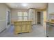 Bright kitchen featuring a center island and stainless steel appliances at 2436 Green Hollow Ct, Conyers, GA 30012