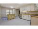 Bright kitchen with white cabinetry, stainless steel appliances and center island at 2436 Green Hollow Ct, Conyers, GA 30012