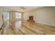 Inviting living room featuring wood floors, a brick fireplace, and ample natural light, perfect for gatherings at 2436 Green Hollow Ct, Conyers, GA 30012