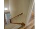 Staircase features a carpet runner and wood railing at 2436 Green Hollow Ct, Conyers, GA 30012