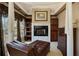 Sitting area with fireplace, window, seating and built in storage at 3410 Kates Way, Duluth, GA 30097