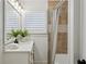 Bright bathroom with white cabinets and warm toned tile shower at 1168 Mclynn Ne Ave, Atlanta, GA 30306