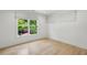 A bright, minimalist bedroom offers a tranquil retreat with a verdant view at 1168 Mclynn Ne Ave, Atlanta, GA 30306