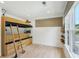 Bedroom with built-in bunk, ladder, shelves and a window with shade at 1168 Mclynn Ne Ave, Atlanta, GA 30306