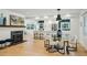 Open-concept living with modern lighting, gas fireplace and a glimpse of the well-appointed kitchen at 1168 Mclynn Ne Ave, Atlanta, GA 30306