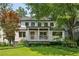Charming two-story home with a welcoming front porch and lush green lawn at 1168 Mclynn Ne Ave, Atlanta, GA 30306