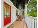 Charming front porch with red door and rocking chairs, offering a welcoming entrance at 1168 Mclynn Ne Ave, Atlanta, GA 30306