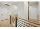 Hallway with modern black metal and natural wood handrail at 1168 Mclynn Ne Ave, Atlanta, GA 30306