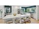 Beautiful kitchen with white cabinets, a large island, stainless steel appliances, and barstool seating at 1168 Mclynn Ne Ave, Atlanta, GA 30306
