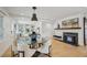 Inviting living area with fireplace, built-ins, and hardwood floors that transition from dining to seating, creating warmth at 1168 Mclynn Ne Ave, Atlanta, GA 30306