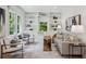 Living room with bespoke built-in shelves for storage and decor display and natural light at 1168 Mclynn Ne Ave, Atlanta, GA 30306