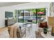 Modern living room with a glass sliding doors that open to the pool and entertaining area at 1168 Mclynn Ne Ave, Atlanta, GA 30306