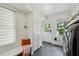 A practical mud room is equipped with storage, seating, and an adjacent laundry area at 1168 Mclynn Ne Ave, Atlanta, GA 30306