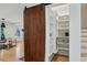 Well-organized pantry with custom shelving and sliding barn door at 1168 Mclynn Ne Ave, Atlanta, GA 30306