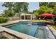 Relaxing pool and spa area with waterfall feature and outdoor seating at 1168 Mclynn Ne Ave, Atlanta, GA 30306