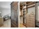 A spacious walk-in closet offers custom shelving, drawers, and a full-length mirror at 1168 Mclynn Ne Ave, Atlanta, GA 30306