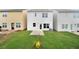 Home's rear exterior with lawn, concrete slab, and freshly installed HVAC at 150 Chandler Trce, Covington, GA 30016