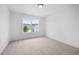 Bright bedroom with a large window overlooking the neighborhood at 150 Chandler Trce, Covington, GA 30016