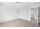 A bedroom with carpet, white walls, and a double door closet at 150 Chandler Trce, Covington, GA 30016