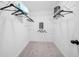 Walk-in closet with carpet flooring and hanging racks for organizing clothes and accessories at 150 Chandler Trce, Covington, GA 30016