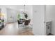 Cozy dining area with modern chandelier, table with seating for four, next to window and exterior door at 150 Chandler Trce, Covington, GA 30016