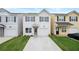 Charming two-story home featuring a light gray exterior, attached garage, and well-maintained front yard at 150 Chandler Trce, Covington, GA 30016