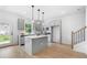 Modern kitchen featuring stainless steel appliances, gray cabinetry, and a central island with pendant lighting at 150 Chandler Trce, Covington, GA 30016