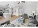 Open concept living room with wood floors and lots of natural light, showcasing modern furniture and neutral color tones at 150 Chandler Trce, Covington, GA 30016