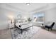 Comfortable main bedroom featuring plush carpet, modern decor, and an abundance of natural light at 150 Chandler Trce, Covington, GA 30016