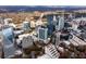 Overhead shot shows a dense city with streets, trees, and towering buildings in an urban landscape at 3324 Peachtree Ne Rd # 1813, Atlanta, GA 30305