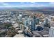 Overhead shot displays the urban skyline amidst trees, streets, and buildings in the surrounding area at 3324 Peachtree Ne Rd # 1813, Atlanta, GA 30305