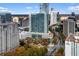 A high-angle view shows a dense urban area with tall hotels, apartments, streets, and green trees at 3324 Peachtree Ne Rd # 1813, Atlanta, GA 30305