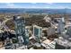 Expansive aerial view showcasing modern high-rise buildings surrounded by lush trees at 3324 Peachtree Ne Rd # 1813, Atlanta, GA 30305