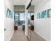 Bright bedroom featuring a balcony with city views, complemented by modern sliding closet doors and stylish decor at 3324 Peachtree Ne Rd # 1813, Atlanta, GA 30305