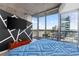 Bright bedroom with balcony access offering panoramic city views at 3324 Peachtree Ne Rd # 1813, Atlanta, GA 30305
