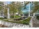 Beautifully landscaped exterior with fountain, flowers, and greenery near building entrance at 3324 Peachtree Ne Rd # 1813, Atlanta, GA 30305